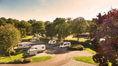Caravan and Motorhome Club site with autumn trees