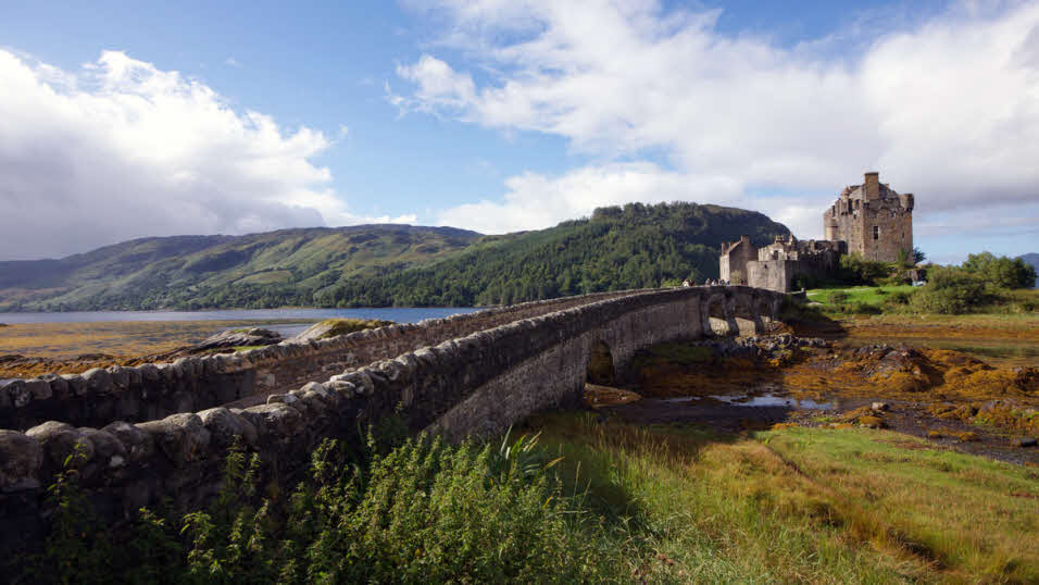 Historical stone bridge in Dorie, Scotland, surrounded by fields
