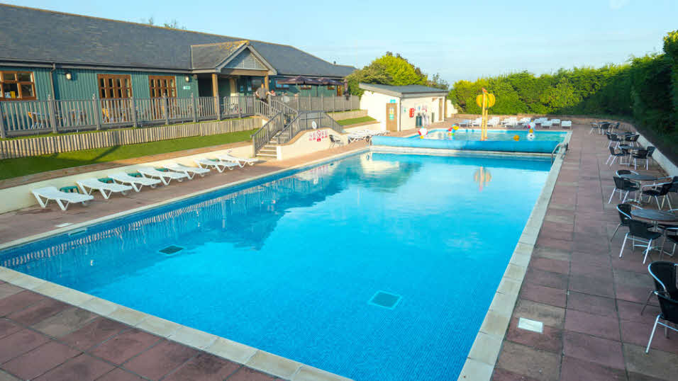 Swimming pool at Hillhead Club site in the summer